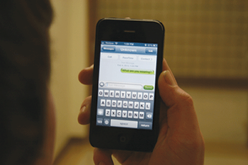 A teen sends an explicit message on his cell phone. In a recent survey, 
27 percent of ALHS students said they have sent or received a sext. 