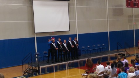 Last year's Homecoming King, Connor Larson crowns Matt Tate (12) as Homecoming King during the coronation ceremony. This year's ceremony was held in the ALHS gym instead of the auditorium where it had been held in past years.