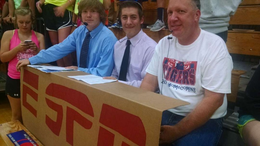 Mr. Grossklaus joins Parker Mullenbach (12), and Tanner Bellrichard (12) at the ESPN desk at tonights volleyball match.