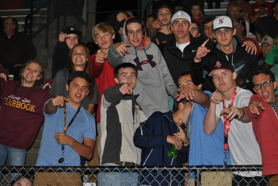 Tiger fans take a quick break from cheering on the boys to pose for a photo.