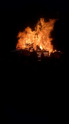 ALHS students celebrate homecoming with a large bonfire held in the parking lot of Hammer Field after the girls soccer game. 