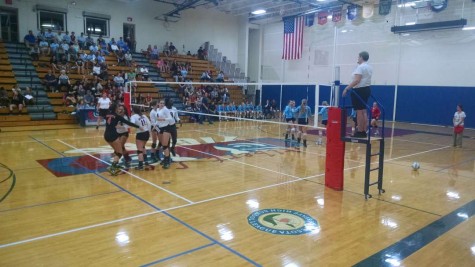 The Albert Lea Varsity Volleyball team pumps each other up during a close game against the John Marshall Rockets. The Tigers left with a victory of 3-1 games won.