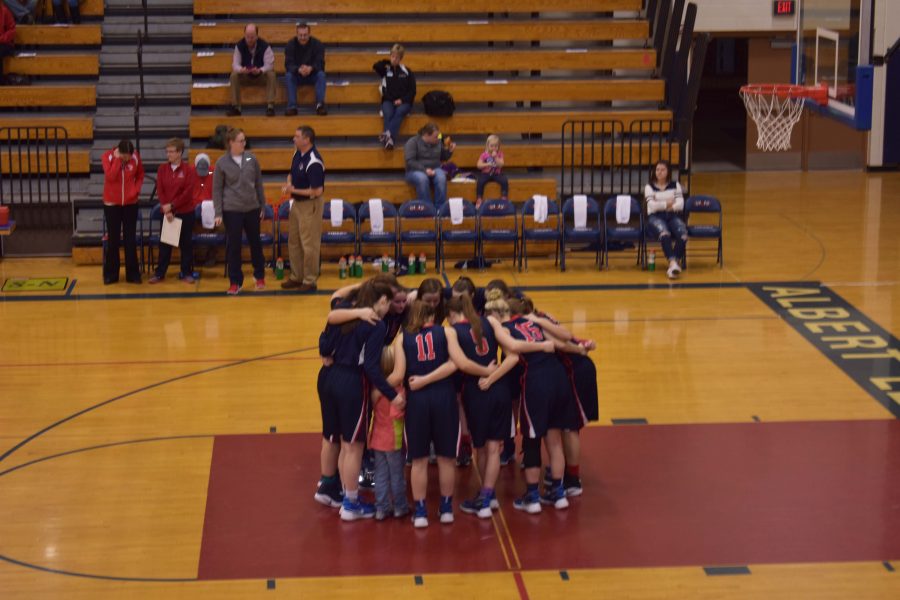 The+team+huddles+to+discuss+plans+and+encourages+one+another+before+the+game.+The+girls+played+Mankato+East+on+Feb+11th