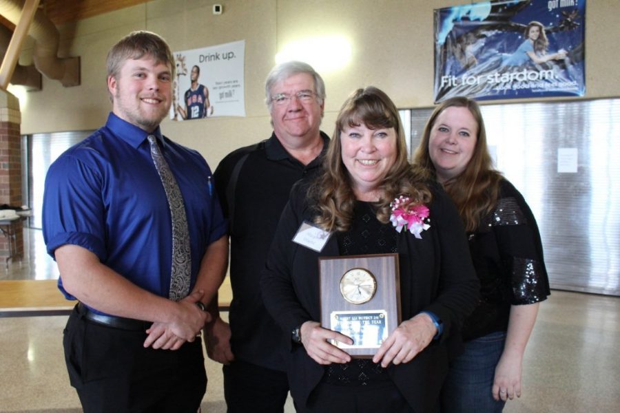 Margo Wayne stands with her family after recieving the District 241 Teacher of the Year award. She had been nominated for the award seven times. “I just feel so blessed that I can get up and do a job where I am excited to see people at,” Wayne said. Photo Sumbitted