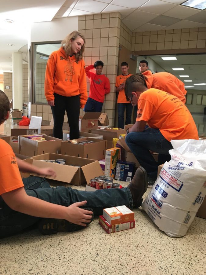 The Robotics Team loading the donated food to the Salvation Army’s truck. Student Council collected food from classrooms every other day.  “I had a lot of fun and it was for a good cause,” said senior Andrew Huerta Ortiz, a member of the robotics team.  