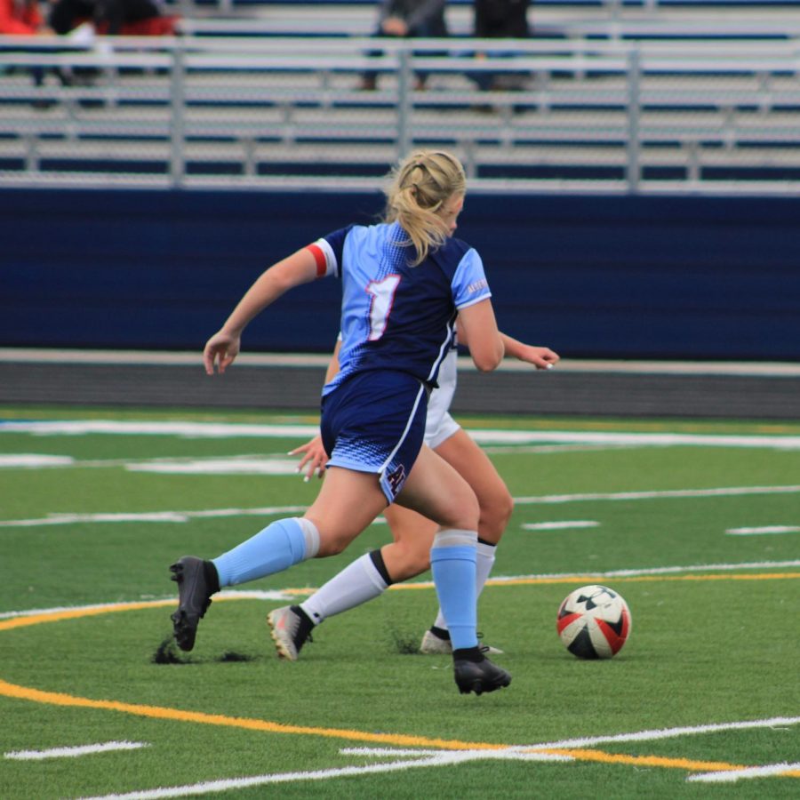 Senior+Maddie+Schneider+is+a+captain+on+the+girls+varsity+soccer+team+with+aspirations+of+playing+college+soccer.+Before+the+season+was+halted%2C+a+college+scout+was+planning+on+attending+the+Sept.+18+game+against+Owatonna+to+possibly+recruit+her.+Missing+the+game+against+Owatonna+will+affect+me+because+the+scout+was+there+to+watch+me+play+and+see+how+I+am+as+a+player%2C+Schneider+said.+If+I+met+requirements%2C+I+would+have+a+spot+on+that+college+team.