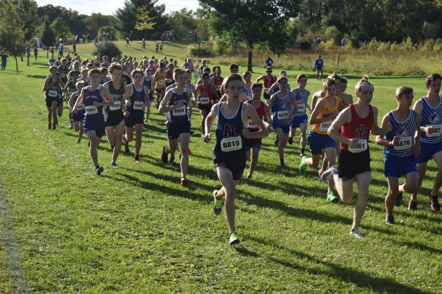 Junior Gavin Hanke leads the pack of runners at the beginning of a race held in Albert Lea. Hanke was named the Section 1AA champion after winning the section race on Oct. 28. 