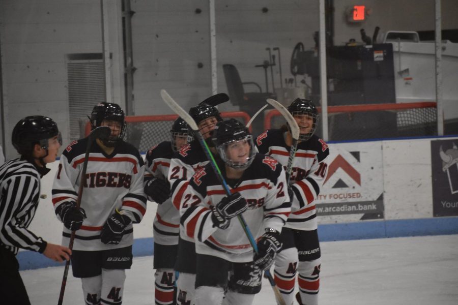 Sophomore Liley Steven smiles with her teammates after scoring the first goal of the game. 