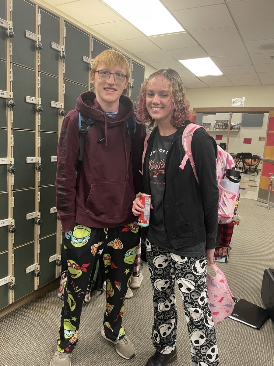 Seniors Tayla Hendrickson and Eric Steele pose for a picture for Pajama Day in December 11th, 2023 in the music suite for Holidaze in Albert Lea High School. 