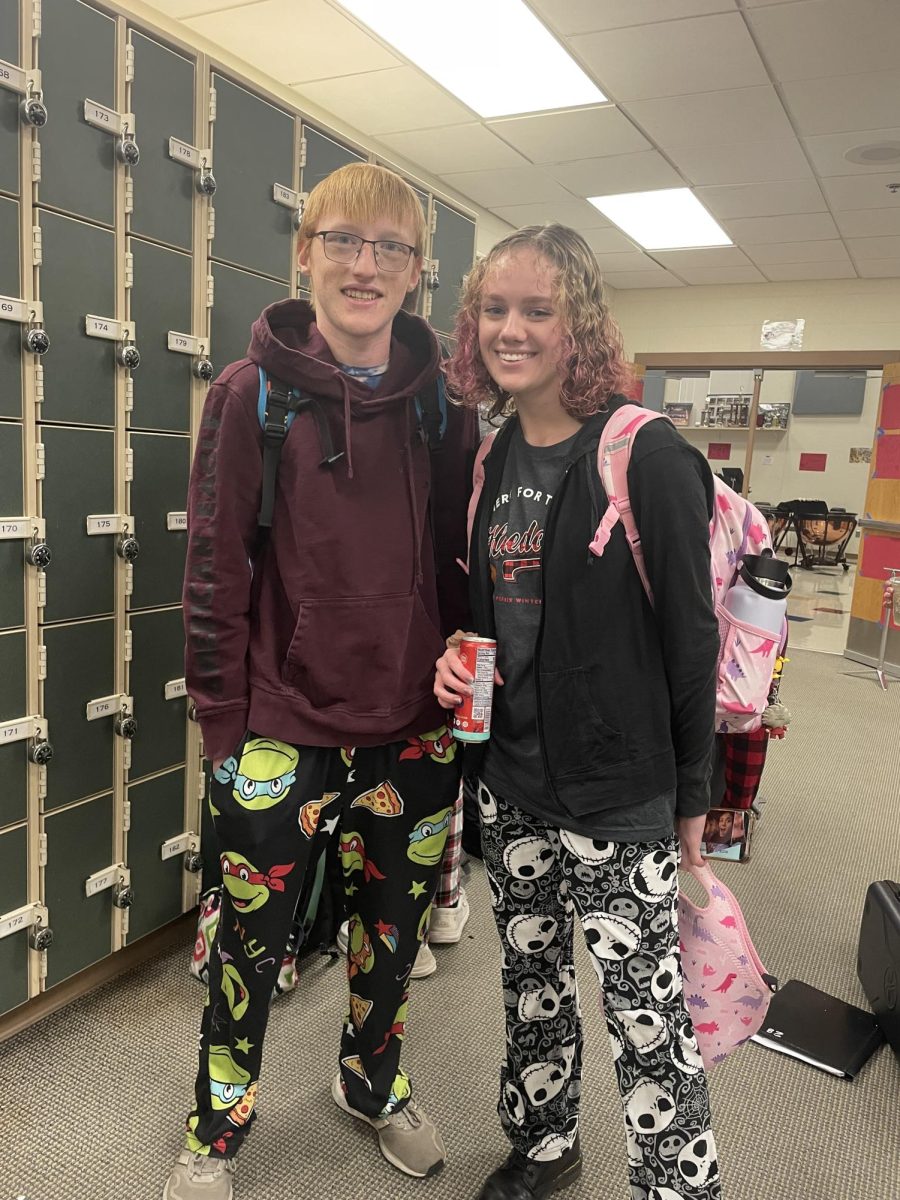 Seniors Tayla Hendrickson and Eric Steele pose for a picture for Pajama Day in December 11th, 2023 in the music suite for Holidaze in Albert Lea High School. 