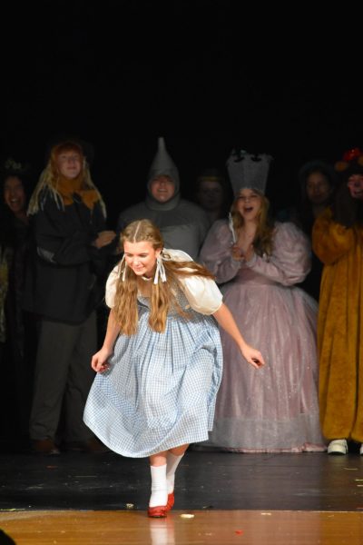 Junior Evie Dawson takes her first bow as Dorothy Hale after starring in Albert Lea High School’s production of the “Wizard of Oz”. The fall musical was Nov. 30, Dec. 1 and Dec. 3 in the auditorium. Photo by Rosa Corey-Gruenes