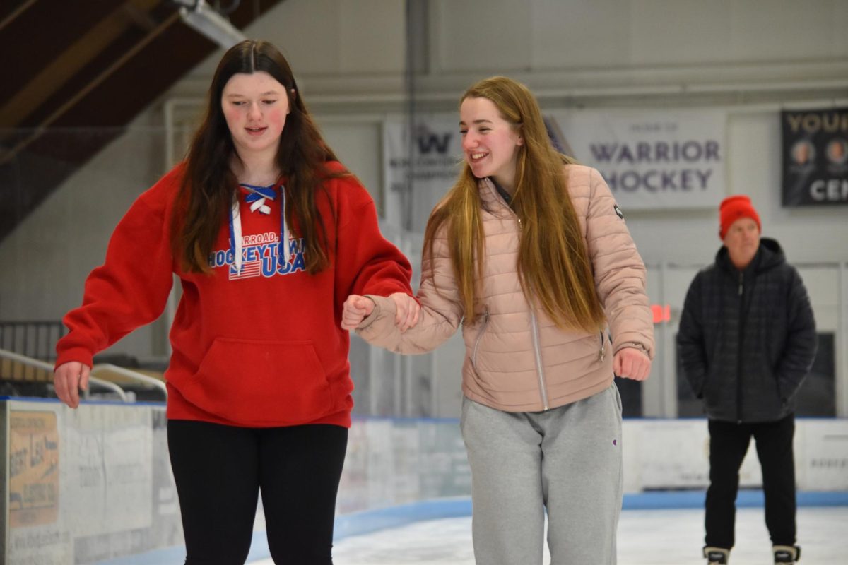 Juniors Sophie Quam and Lauren Raleigh skating at the Albert lea Arena on Feb. 17 for the Winterfest skate.  