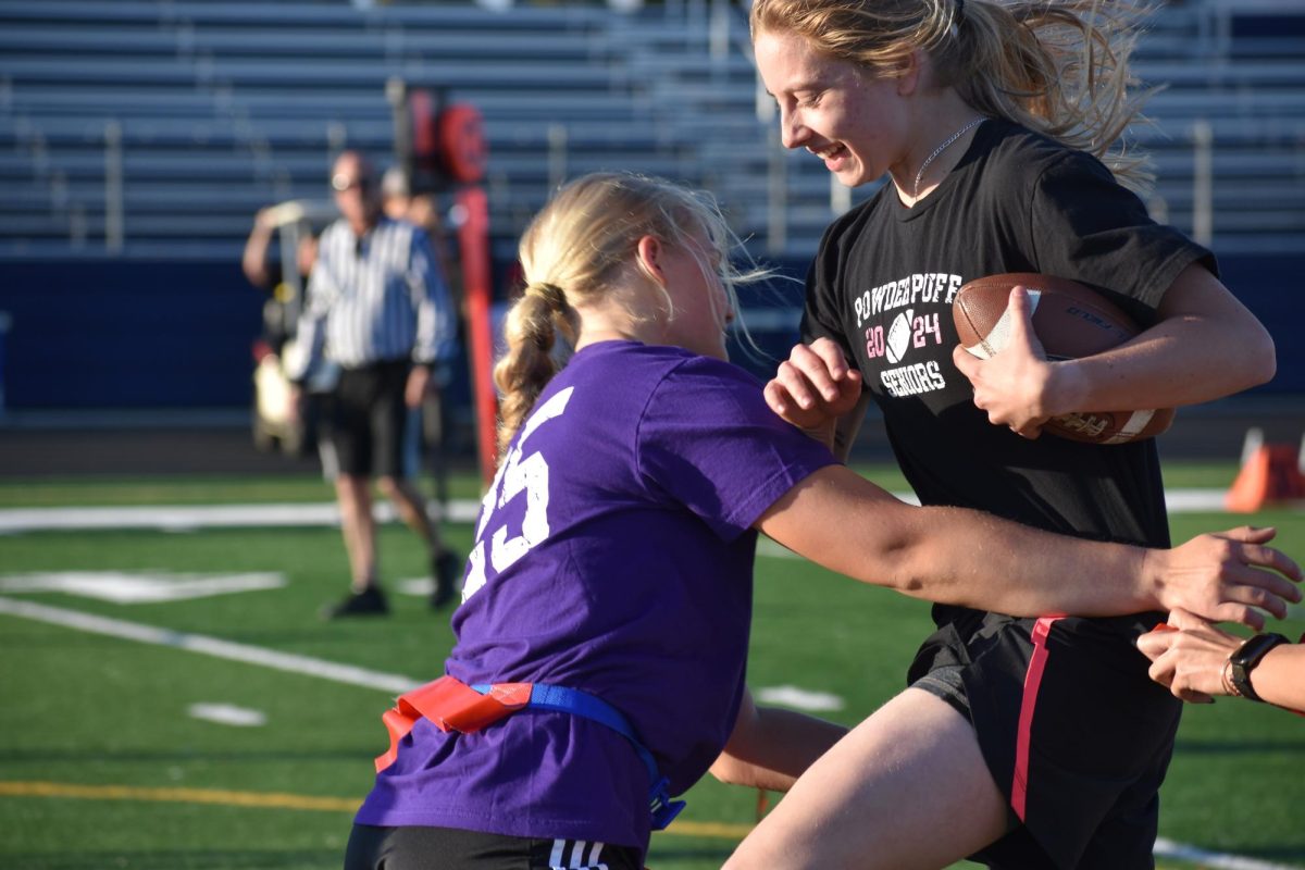 Senior Elizabeth Wallace getting hugged by Junior for Powderpuff on May 10th, 2024.