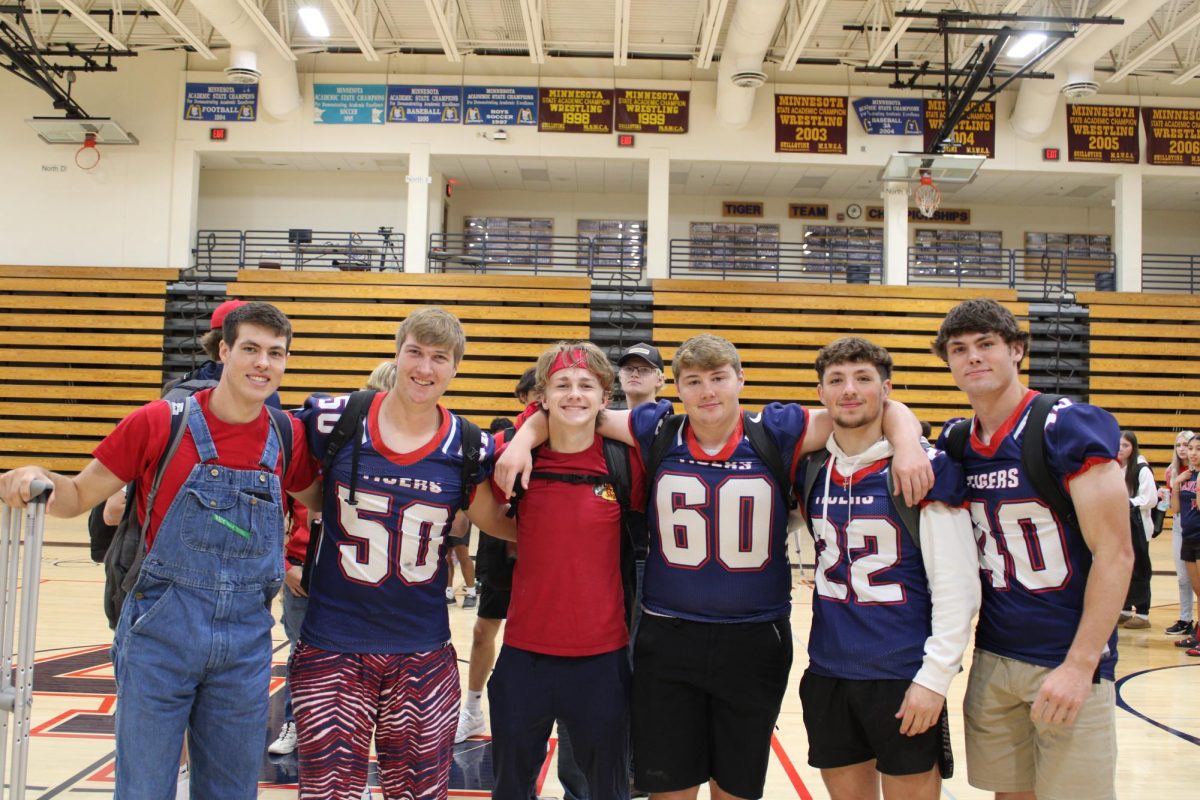 Seniors Mason Attig, Reese Jeffery, Keaton Bremer, Evan Schroeder, Devin Gonzalez , and Maverick Attig wearing cherry and blue on Sept. 27.