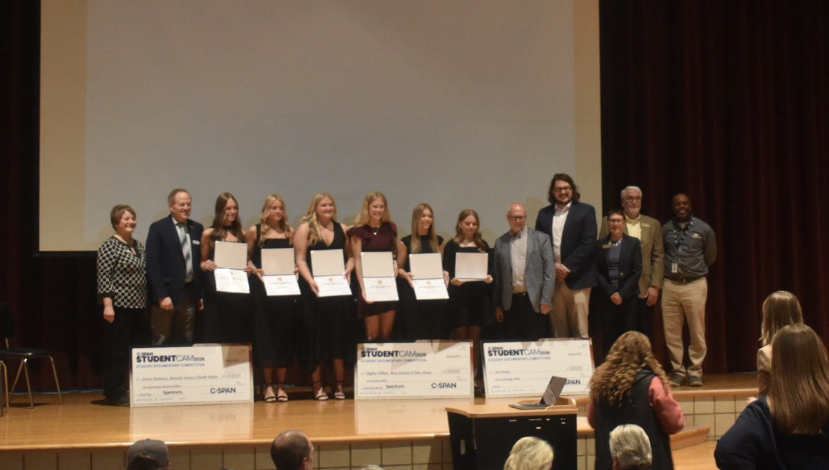 Outreach Rep. Michele Schroeder, and Mayor Rich Murray, posing alongside seniors Danica Pestorious, Brielle Bakken, Michaela Hanson, Keira Erickson, Adylan Gilliam, Dani Jensen and teacher Jim Haney. Alongside C-SPAN Spectrum partner David Larson, Jeanne Poppe, Outreach Rep.  Chuck Ackman, and Commissioner Patrice Bailey in Department of Agriculture celebrating the ALHS students C-SPAN acknowledgements on April 20. 