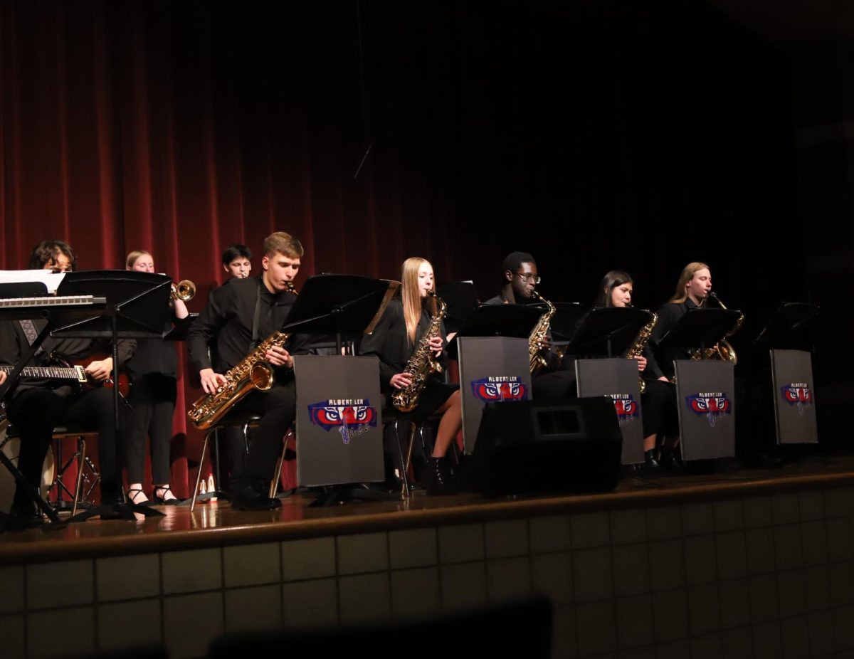 The Albert Lea High School Jazz Band played before Tigers Roar. The band is directed by Suzanne Mauer and contains instruments ranging from electric bass to trombone. The saxophone section includes Hayden Lowe (12), Emilie Troster (10), Kuol Dual (11), Allondra De Rosas Lazaro (11) and Hunter Schmidt (12). The band played nine songs: “A Charlie Brown Christmas”, “Baby, It’s Cold Outside”, “Big Noise from the North Pole”, “Vehicle”, “Let It Snow! Let It Snow! Let It Snow!”, “Aftershock”, “Jazzin’ the World”, “Moondance”, and “And the Angels Swing!”.
