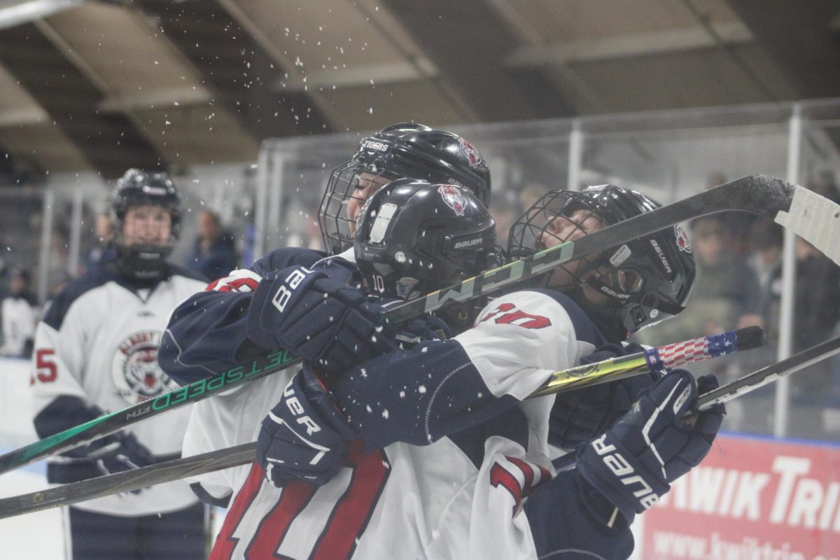 The girls hockey team celebrating at their game on November 13th.