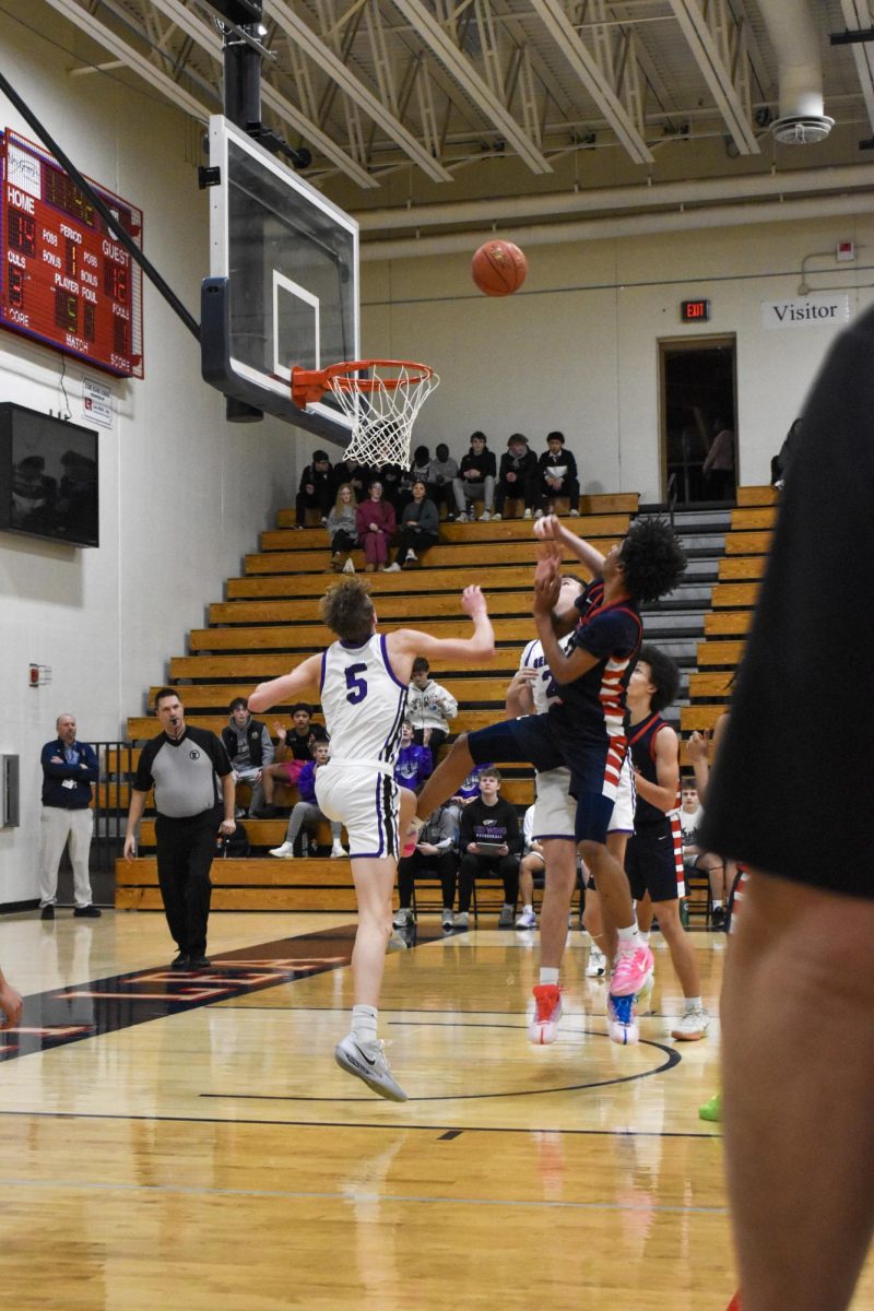 Marques Jeffers-Joseph (11) shooting a basket in the Boys Basketball game against Red Wing on January 20th.
