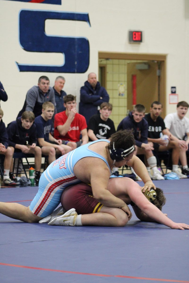 William Velazquez (12) in a wrestling match at the Wrestling meet on February 12th.