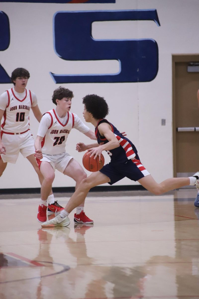 Amun-Ra Brown (10) playing in the Boys Basketball game against John Marshall on February 6th.