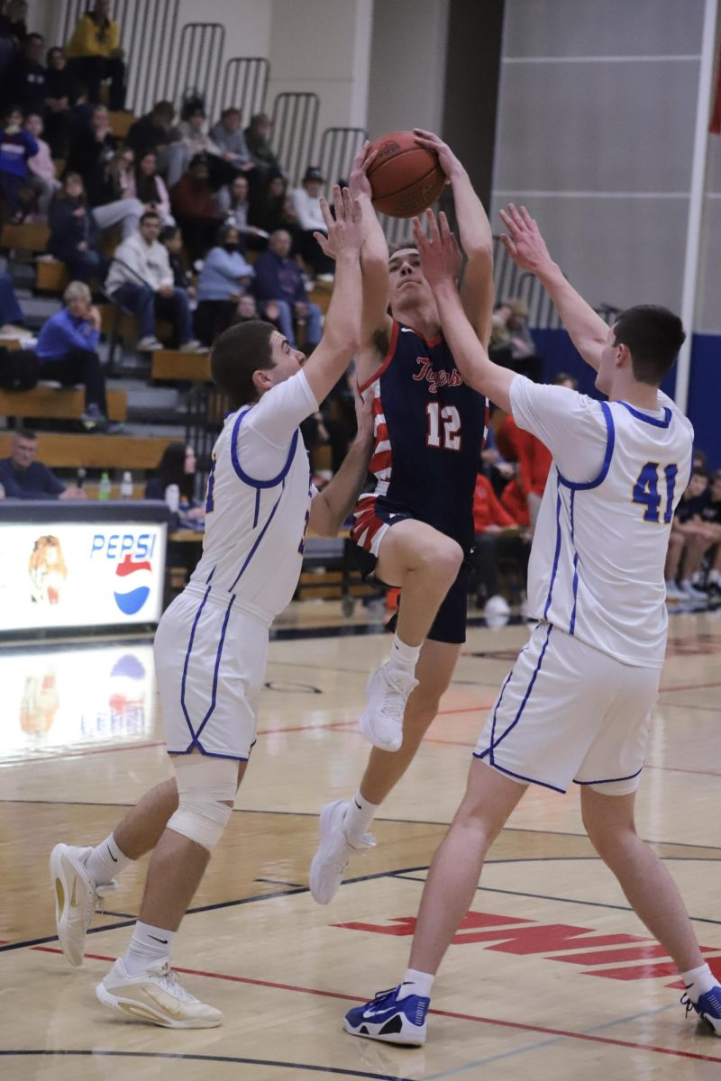 On March 3rd, the ALHS Boys Basketball team held their final home game of the season against Le Sueur-Henderson. AL won with a score of 89-67. Pictured above, Easton Schewe (12) makes a basket.