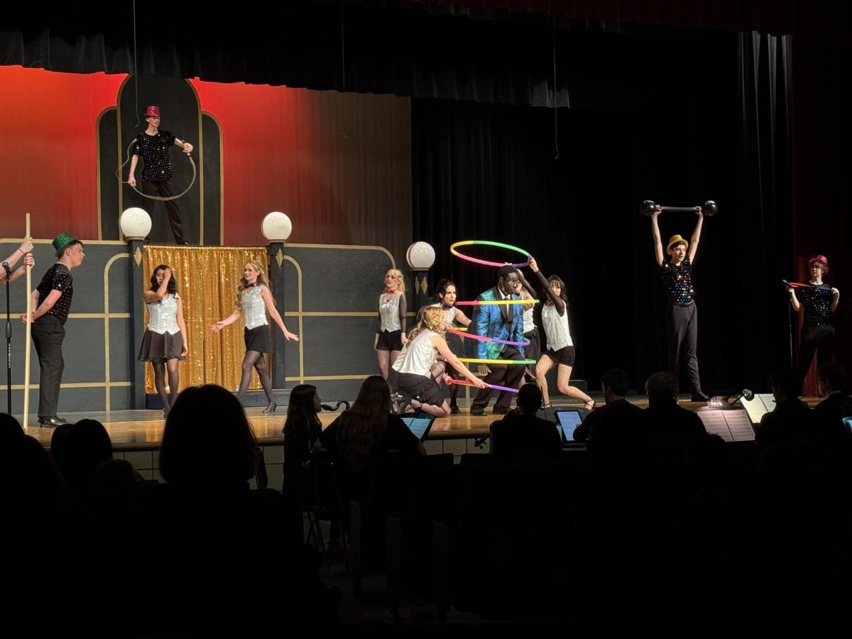 Kuol Dual (11) performing "Razzle Dazzle" from the musical "Chicago" on April 7th's dress rehearsal.  