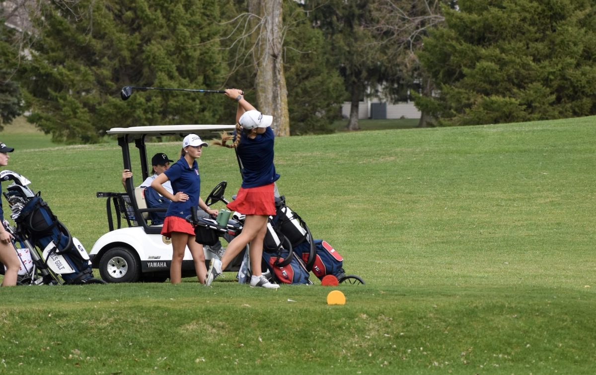 Taylor McKinley (10) golfing during the Girls Golf match on April 13.